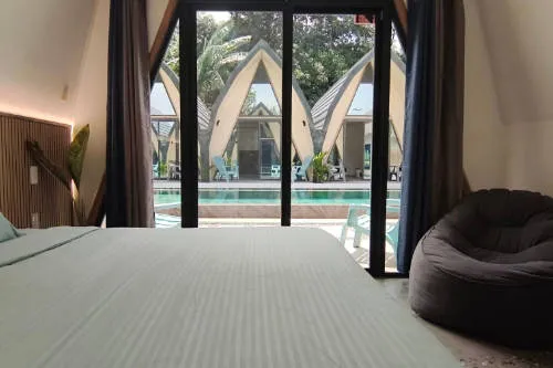King Size Bed in Poolside Room at Lokal Hotels Dauin