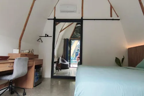 King Size Bed and Furniture in Poolside Room at Lokal Hotels Dauin